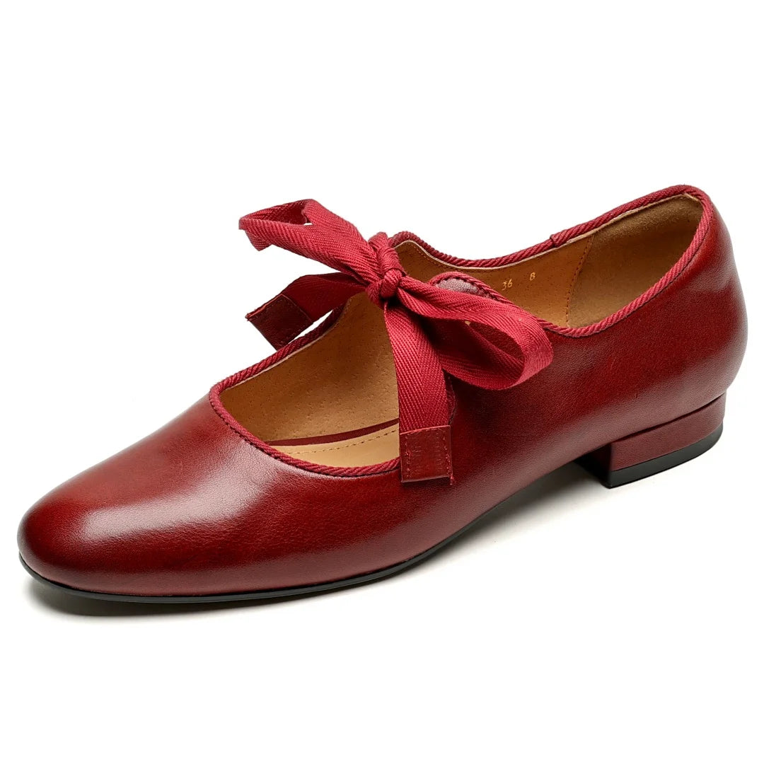 Zapatos de mujer en cuero con moño y punta redonda