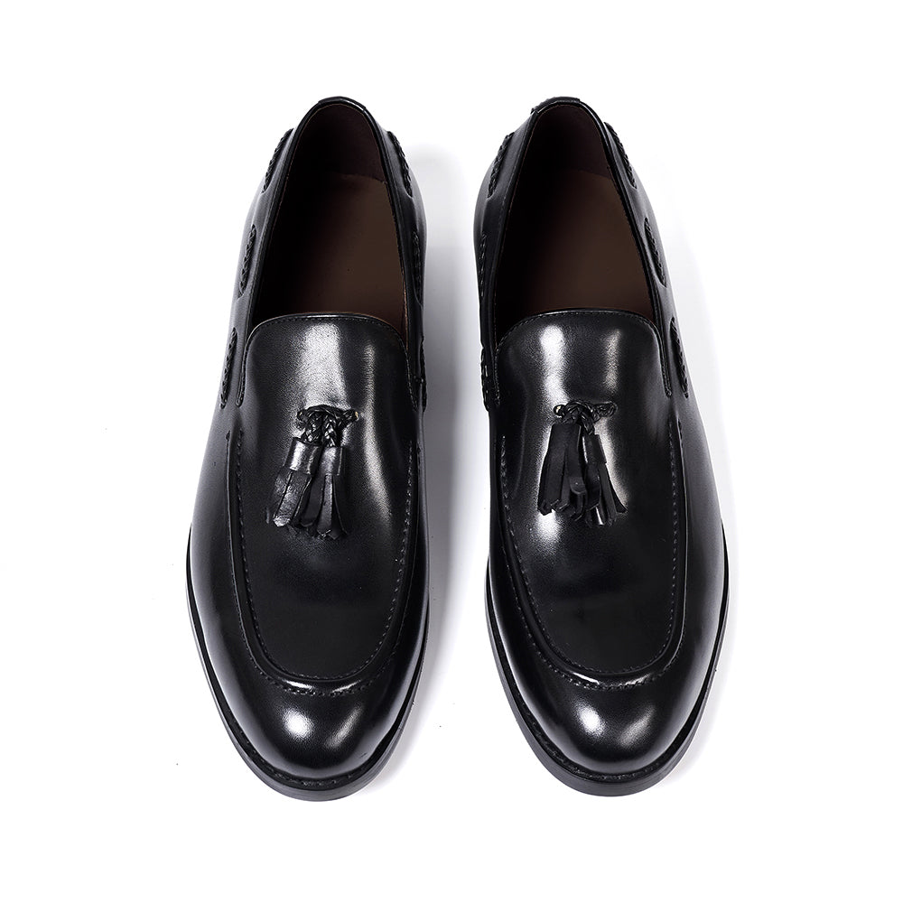 Mocasines de cuero con borlas y punta afinada